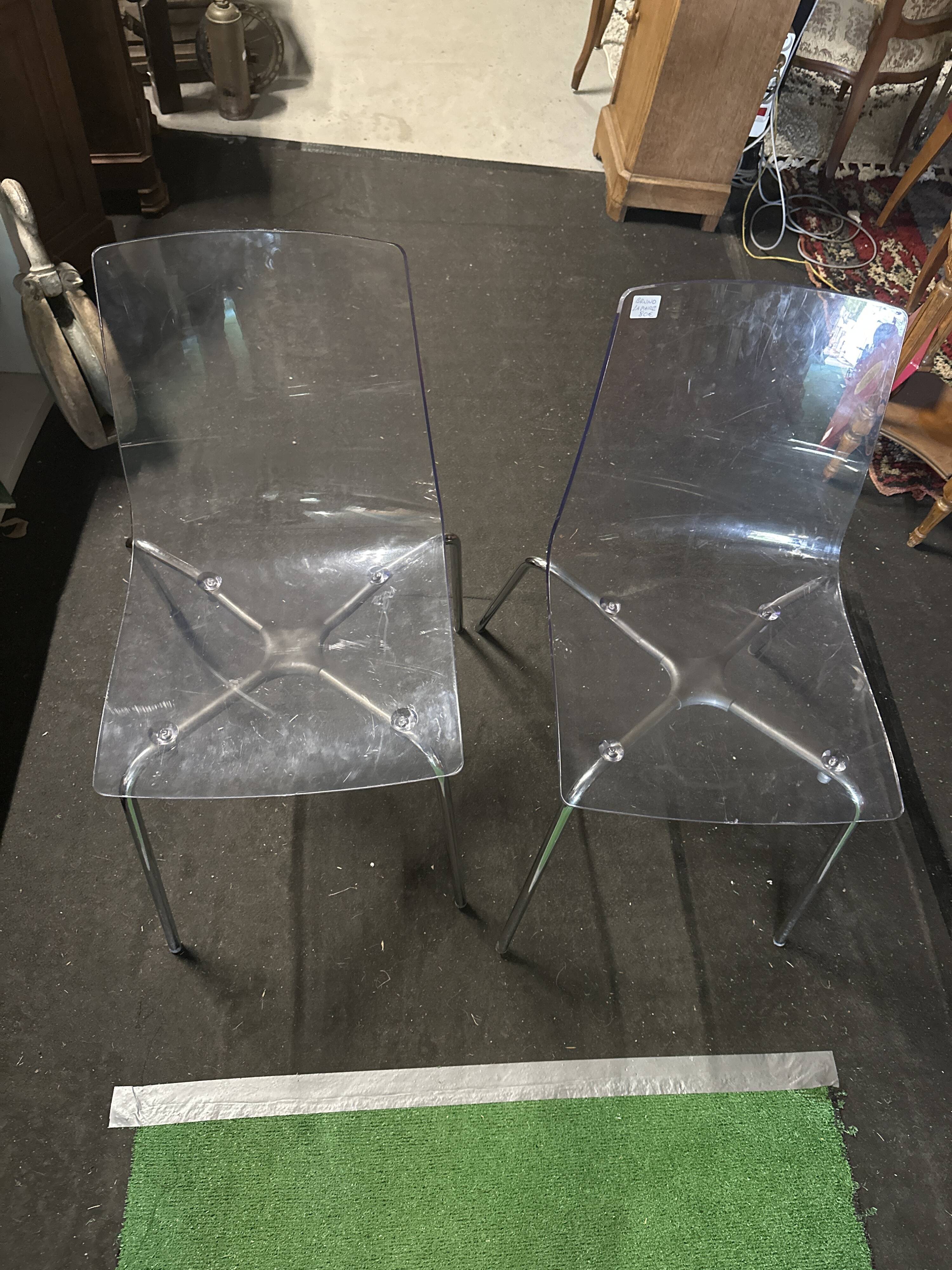 Pair of smoked polycarbonate chairs