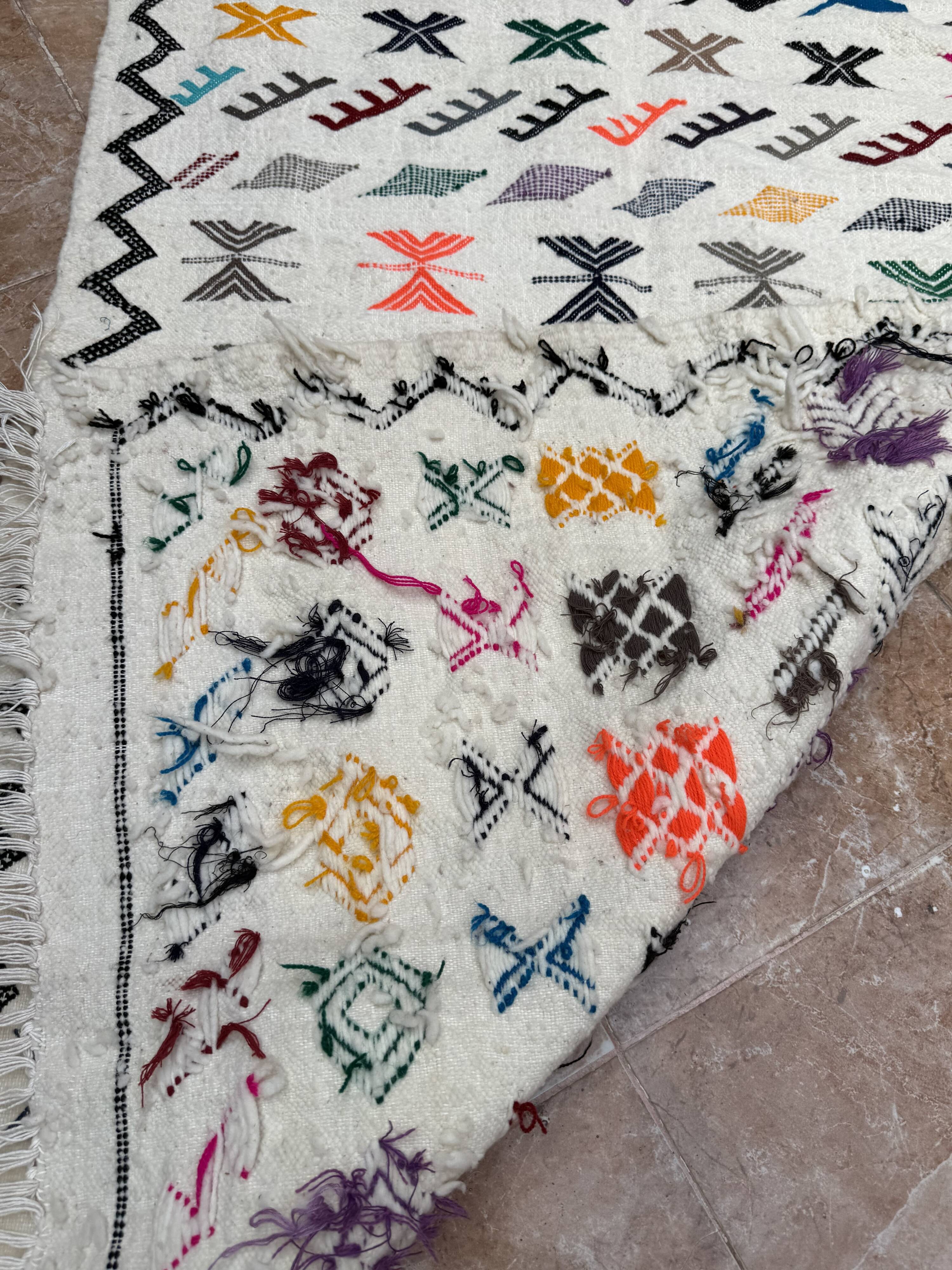 Handwoven Berber kilim rug: small Moroccan decorative rug.