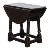Antique English drop-leaf joint stool made of oak from the 18th century