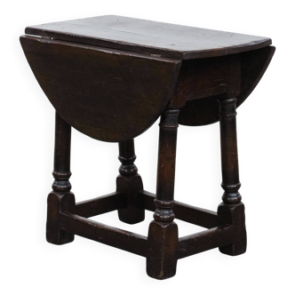 Antique English drop-leaf joint stool made of oak from the 18th century