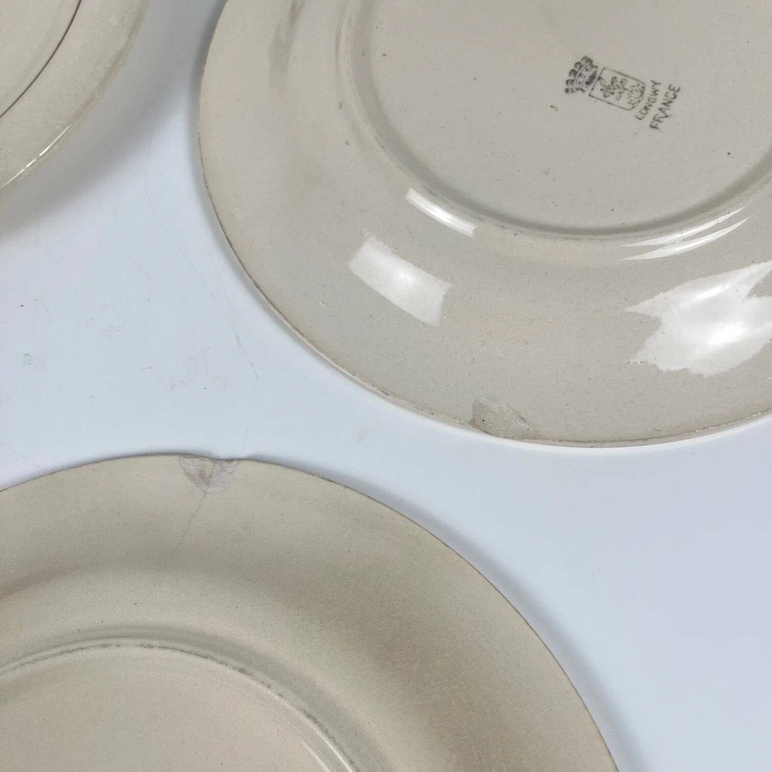 Set of 5 dessert plates Longwy, early 20th century, floral decoration.