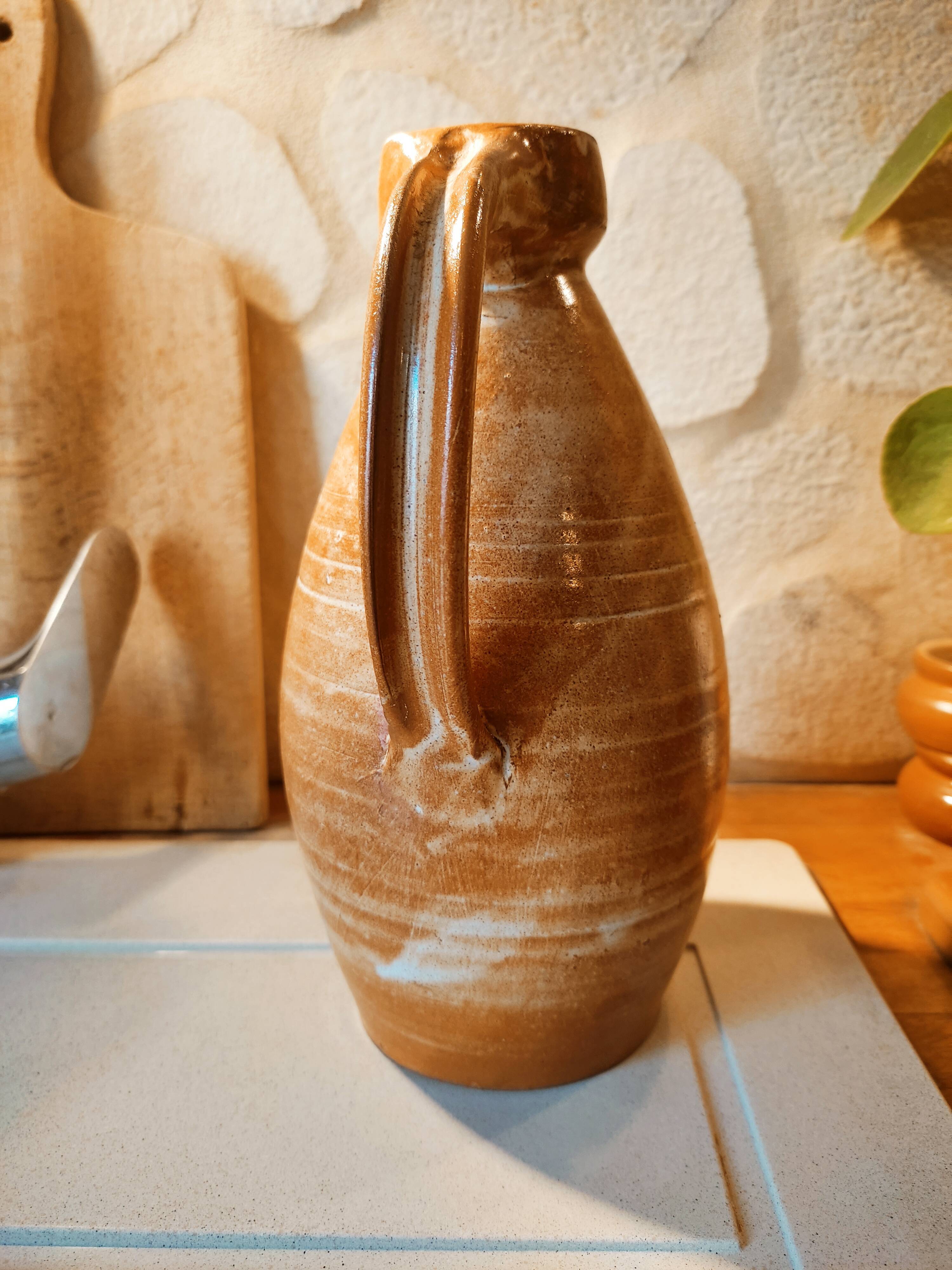 Duo of pitchers water, wine