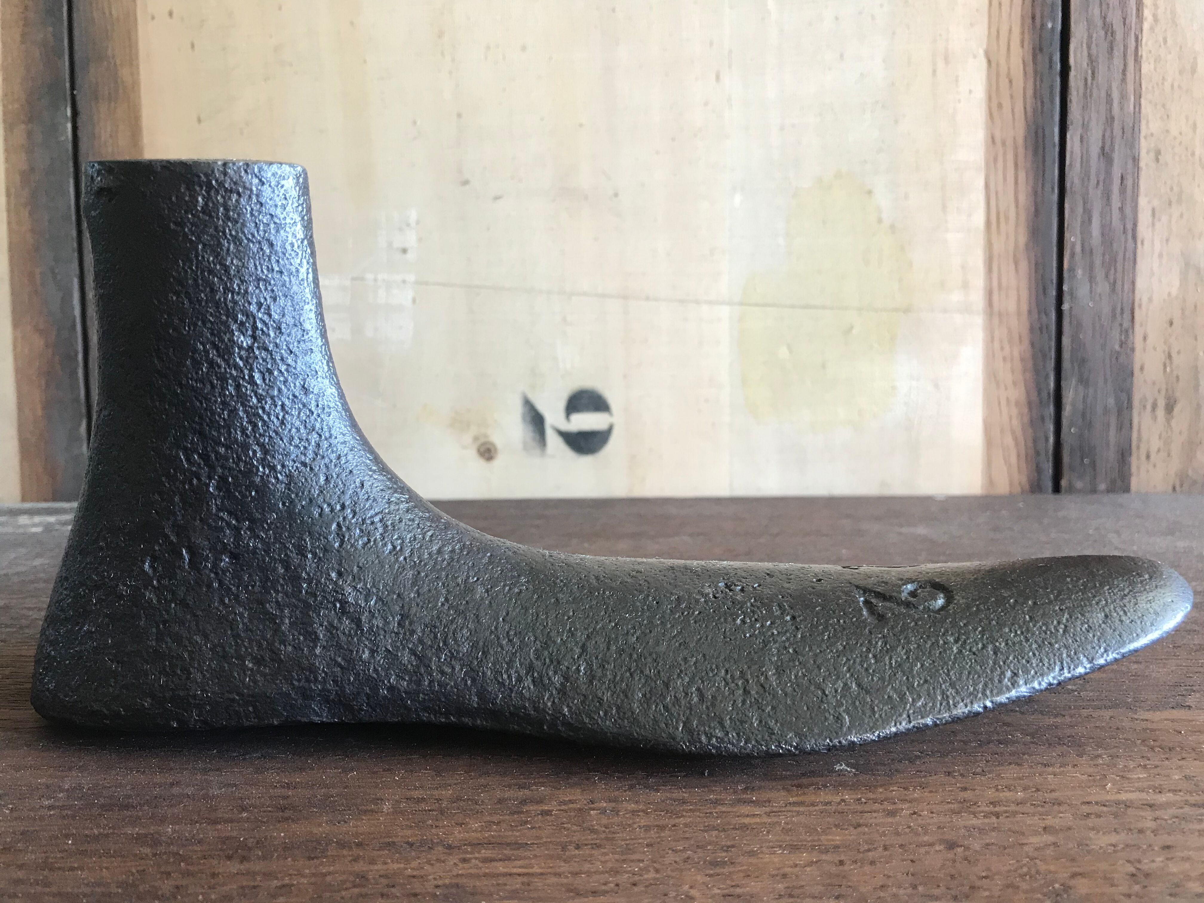 Foot shape vintage metal shoemaker
