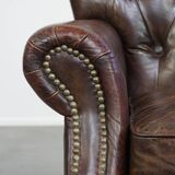 Classic grained cognac colored cowhide leather Chesterfield armchair