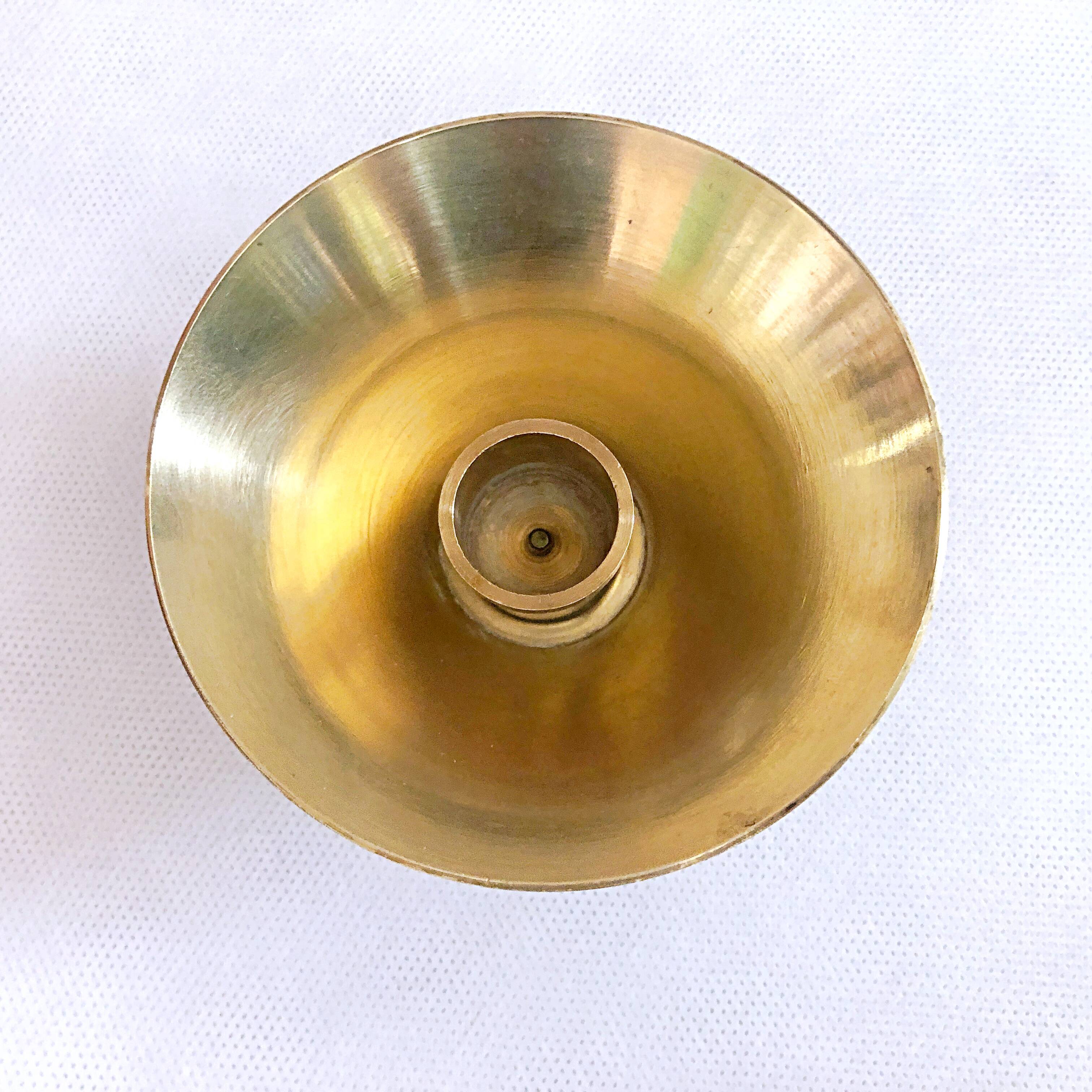 Table candle holder in golden brass
