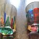 Two Shot Glasses,: One Murano, One CC Zechin using Murano Techniques.