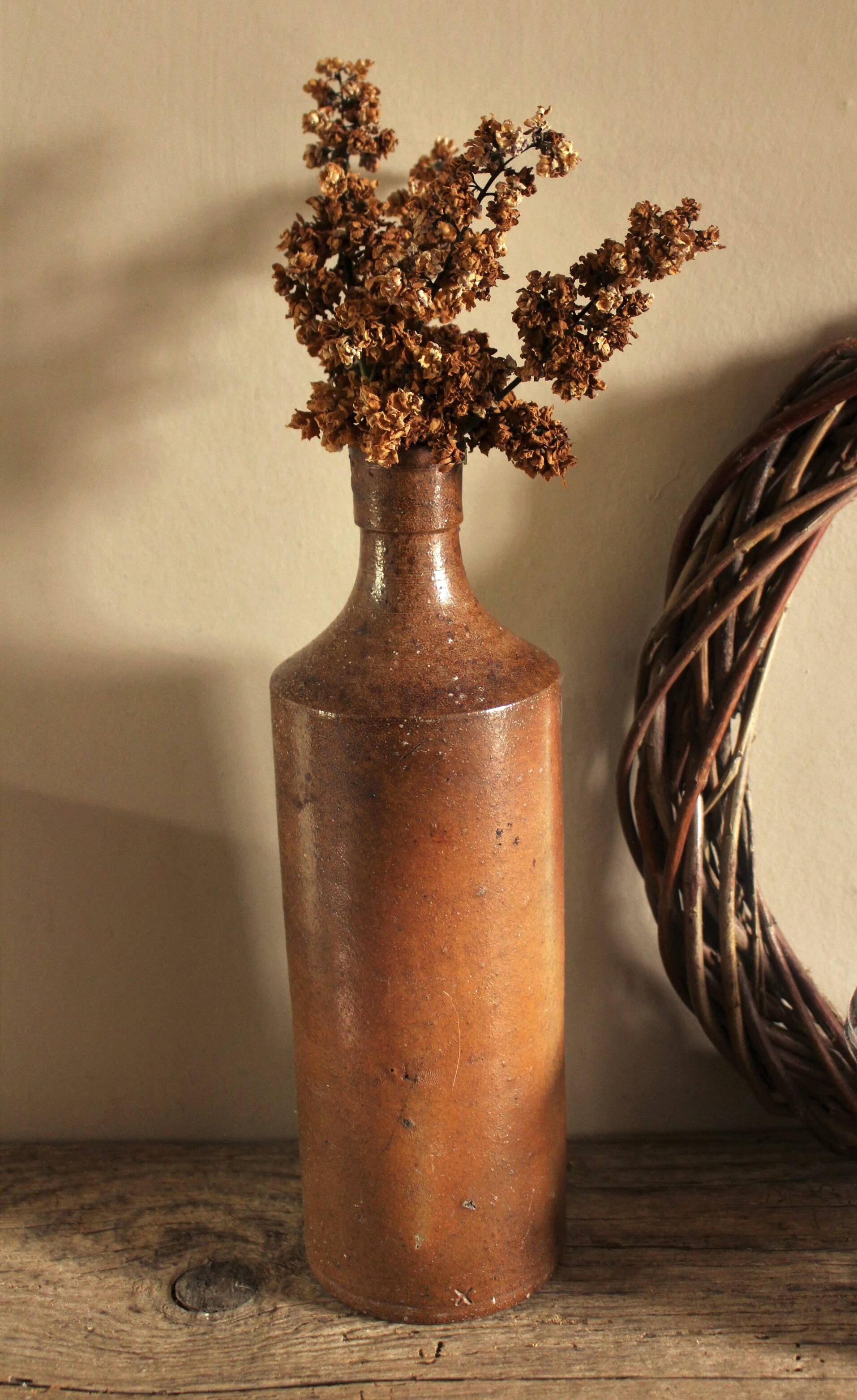 Vintage stoneware liqueur bottle with pouring spout
