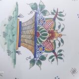 Faience plate from Desvres, Rouen decoration, signed René Delarue.