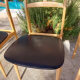 3 Scandinavian-style chairs, light wood and black faux leather