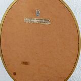 Antique oval-shaped gilded mirror
