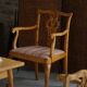 A pair of English Chippendale style armchairs in birch, 20th century, England.