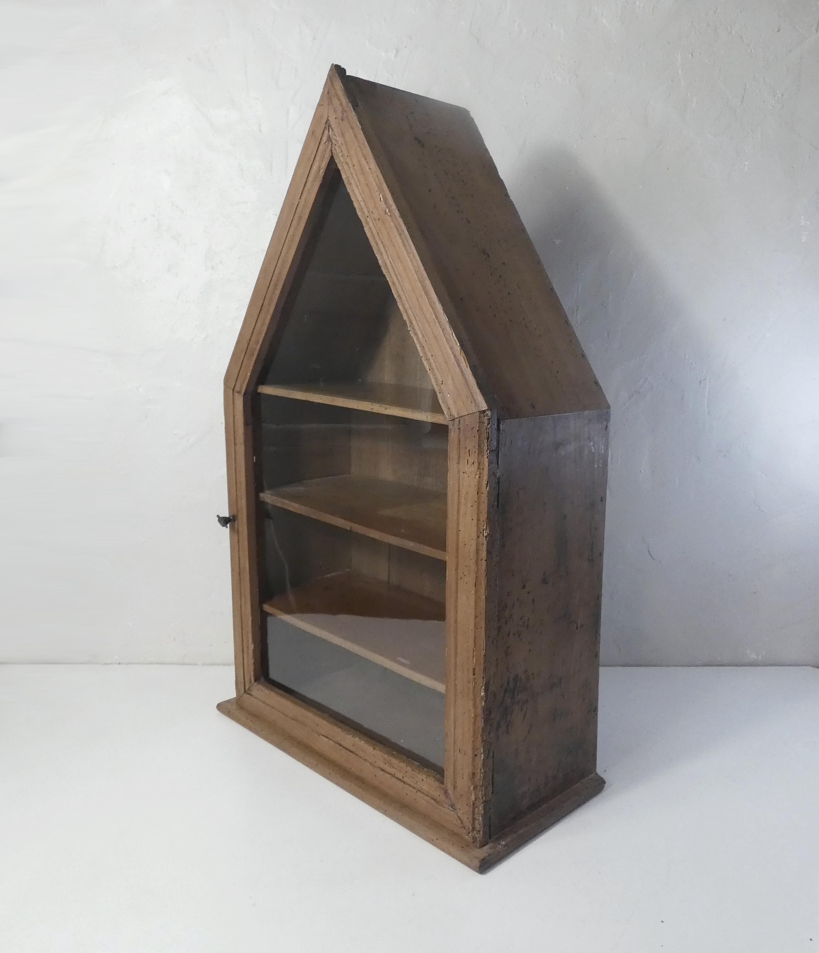 Old niche shelf with glazed statue