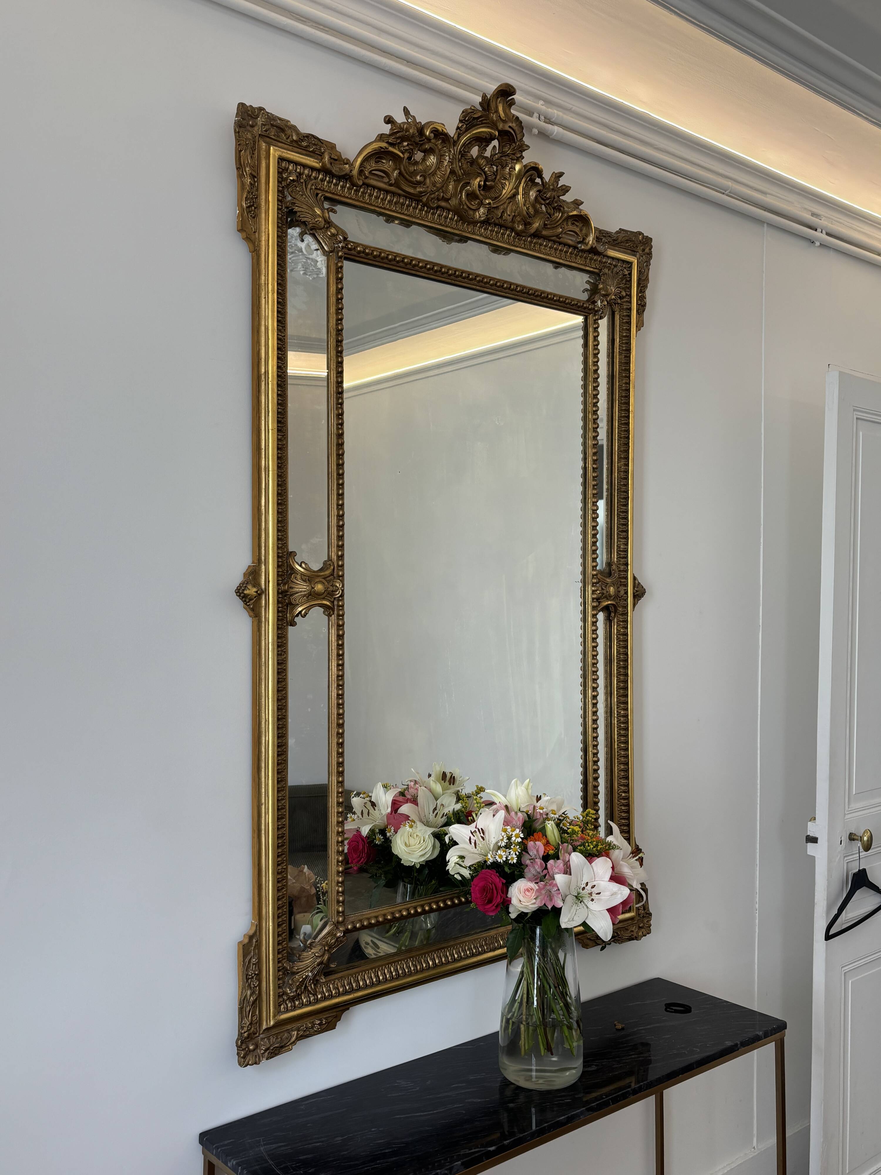 Louis XV style mirror with moulded gilded wood and stucco from the Napoleonic III era.