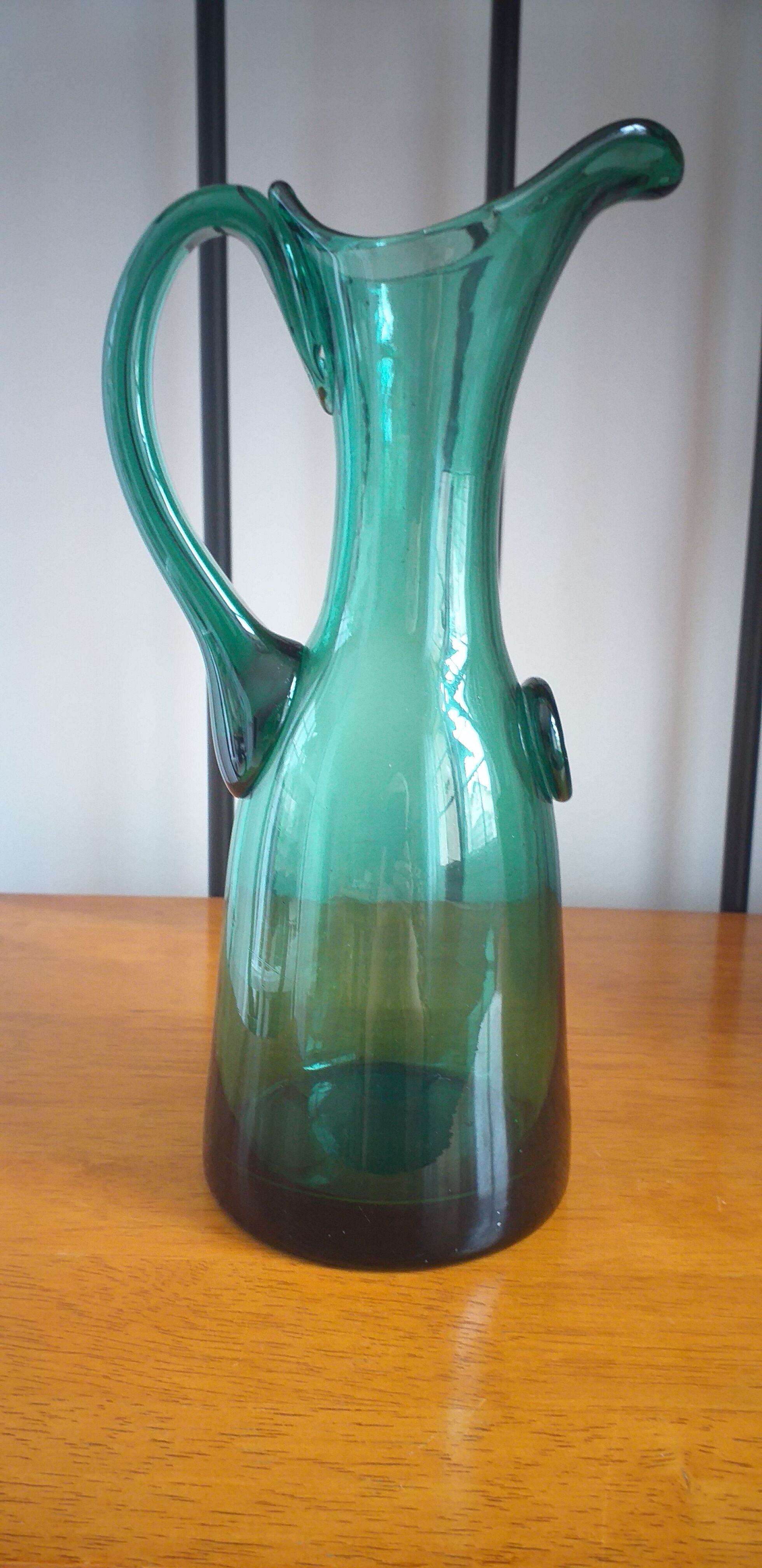 Pitcher made of green glass blown and tinted in the mass