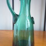Pitcher made of green glass blown and tinted in the mass