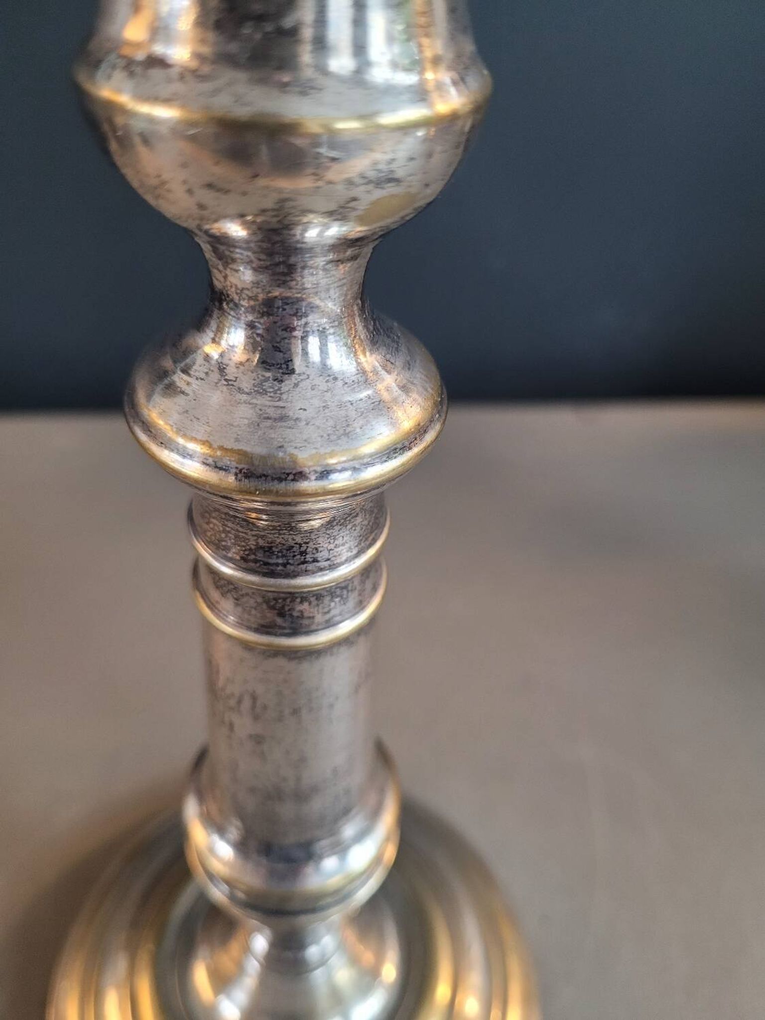 Pair of antique silver-plated brass candlesticks