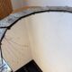Brutalist round hammered gold metal mirror