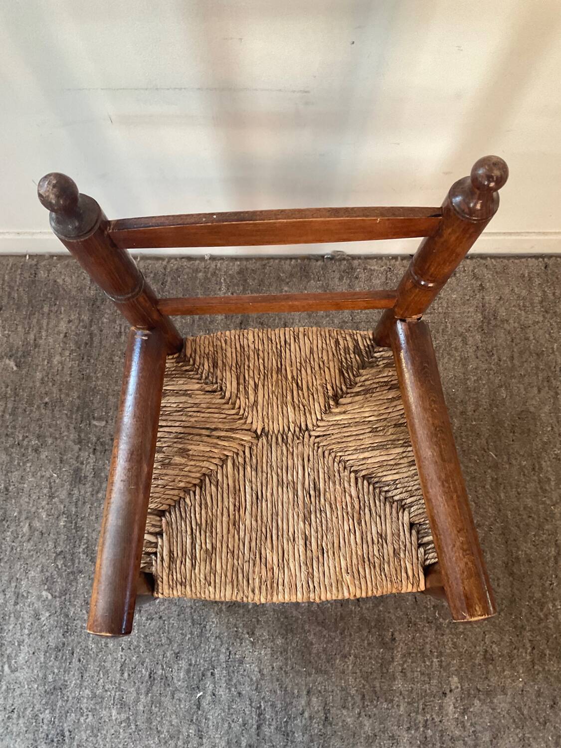 Vintage wooden armchair and straw seat for children