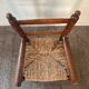 Vintage wooden armchair and straw seat for children