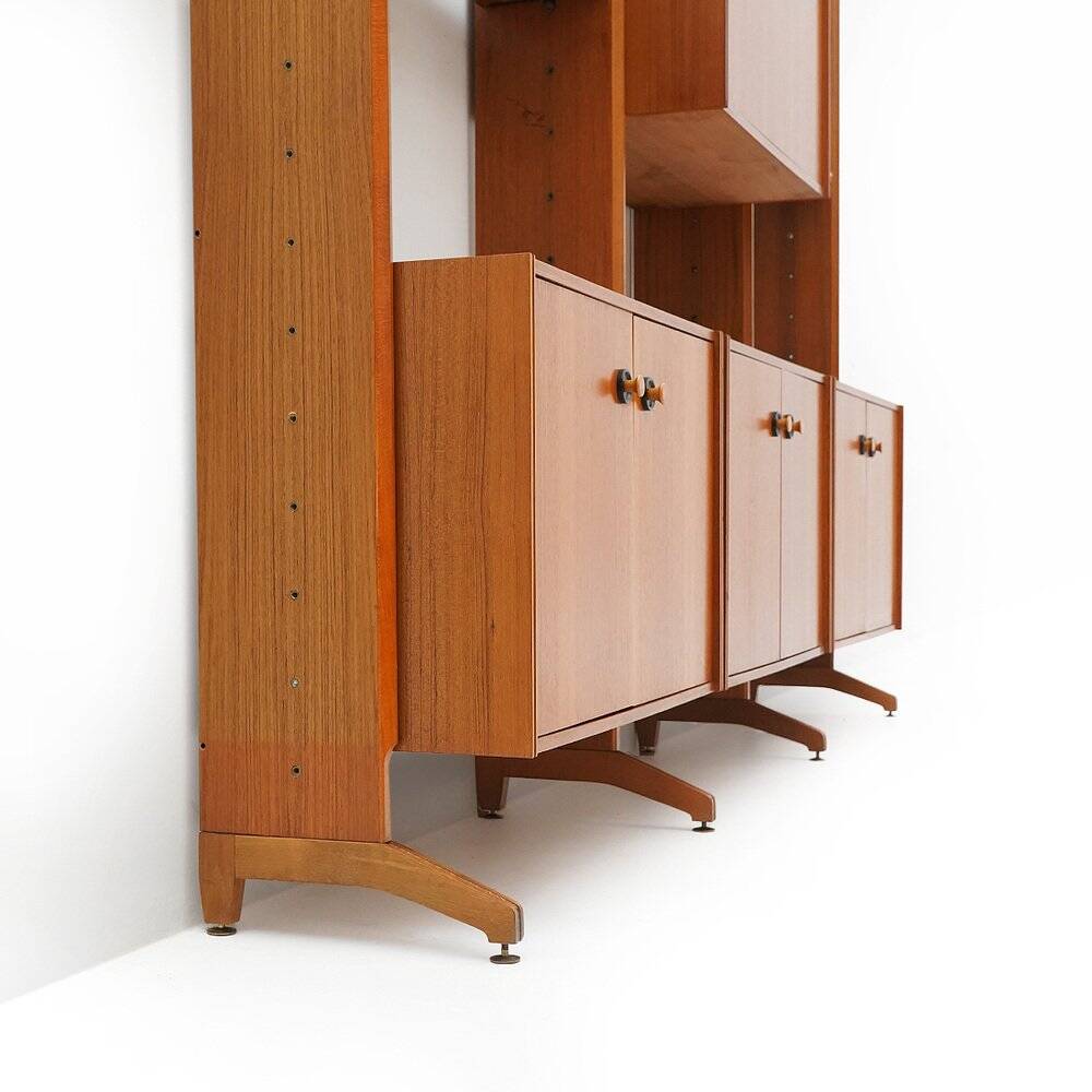 Library with wooden uprights by A.V. Contemporary Furnishings, 1960s.
