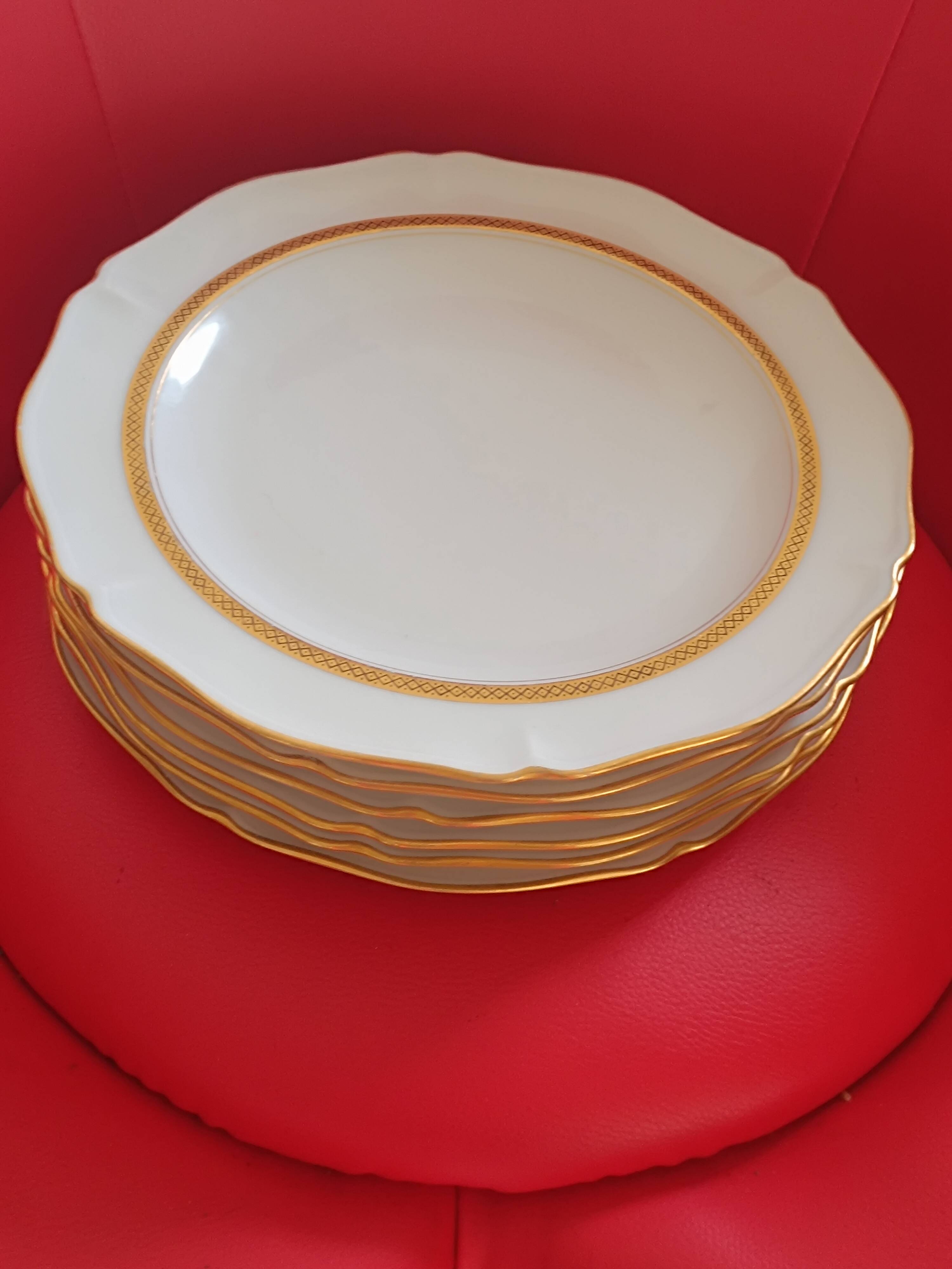 6 Limoges France dinner plates. White, matte gold edging. R; Leclair.