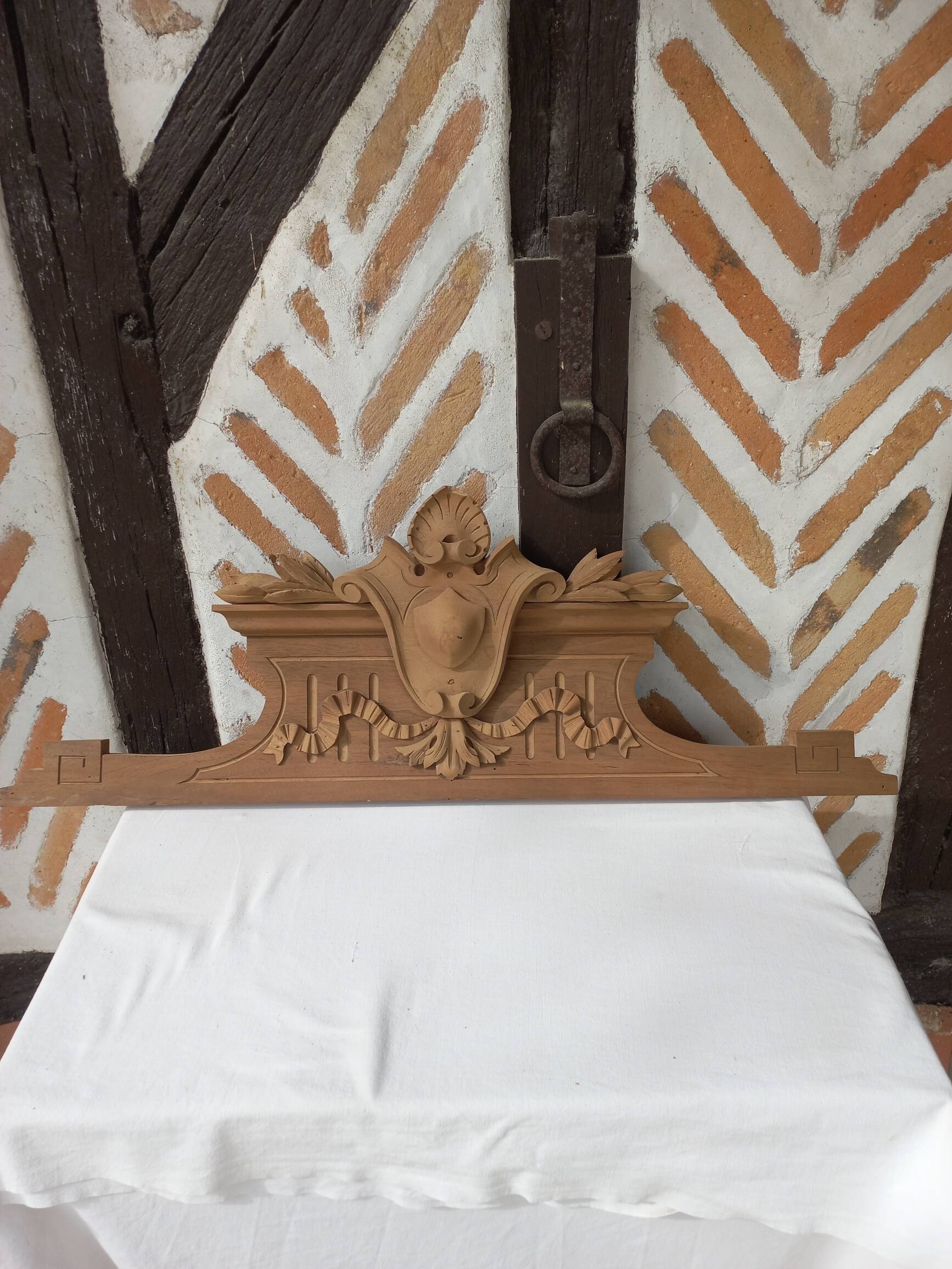 Old sandblasted wooden pediment