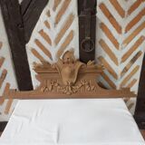 Old sandblasted wooden pediment