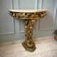 Carved wooden and marble console