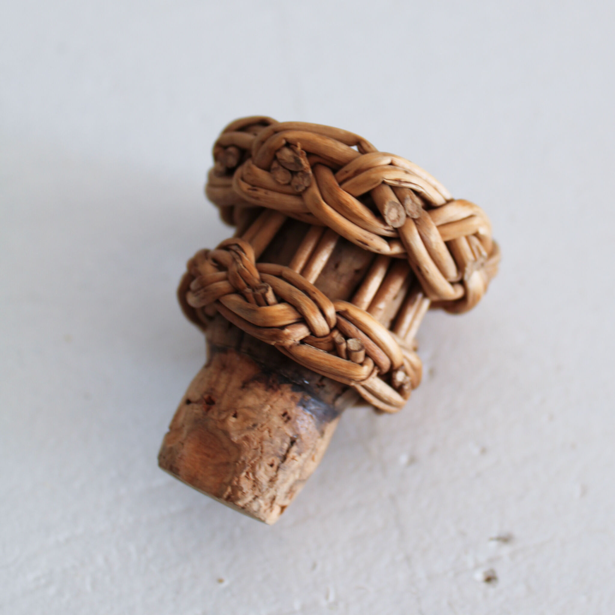 Glass and wicker bottle