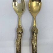Lot of serving spoons, dessert spoon and fork in gold metal.