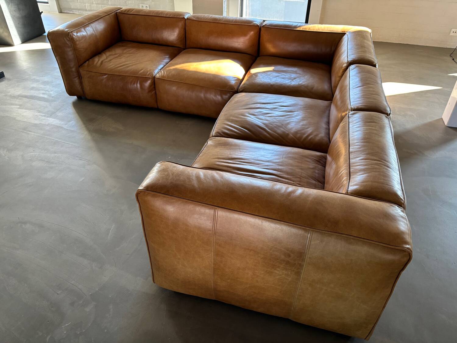 Modular corner sofa + pouf/ottoman in cognac Buffalo leather