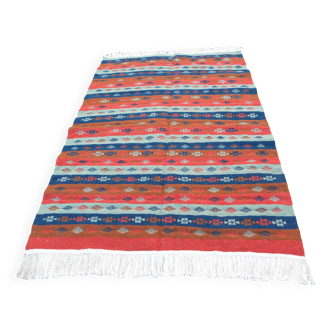 Authentic handmade Tunisian Berber kilim rug in orange wool.