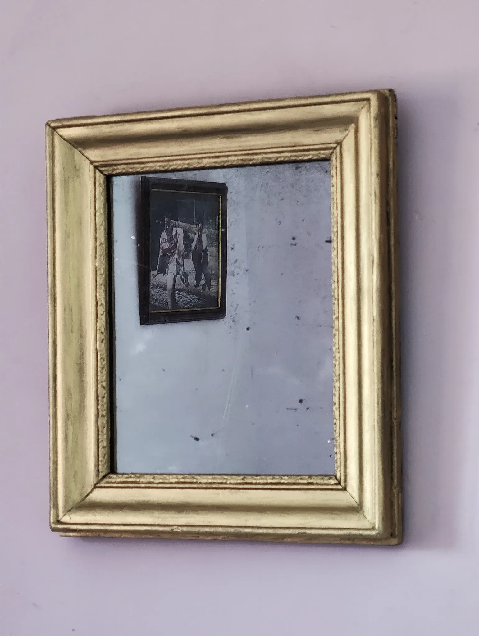 Small Art Deco mirror with a gilded wooden frame.