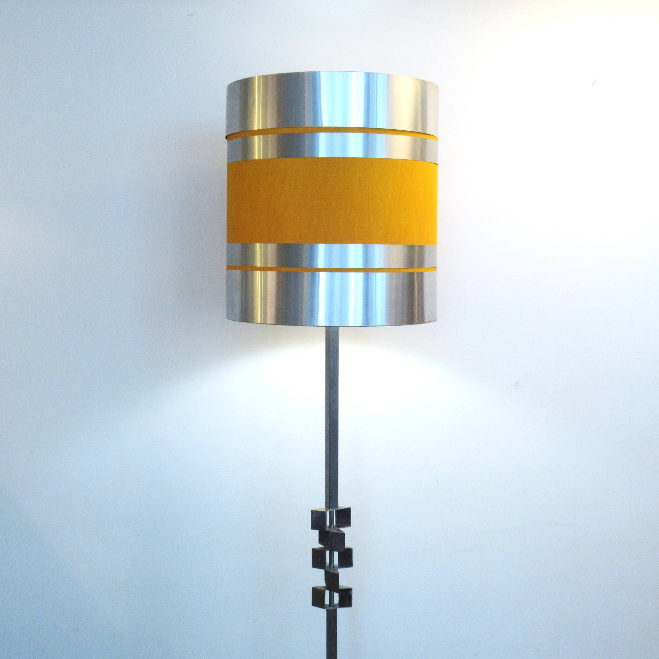 Floor lamp with a large orange shade and metal from the 1960s.