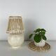 Vintage ceramic lamp with wicker and cotton shade.