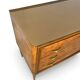 Veneered burl walnut chest of drawers with light warm brown glass top