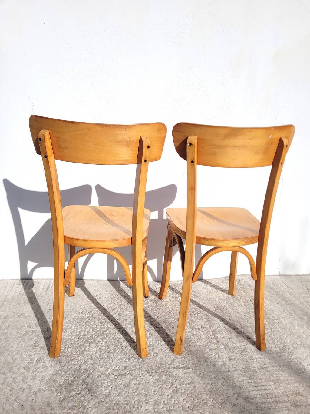 Pair of vintage bistro chairs in golden oak.