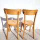 Pair of vintage bistro chairs in golden oak.