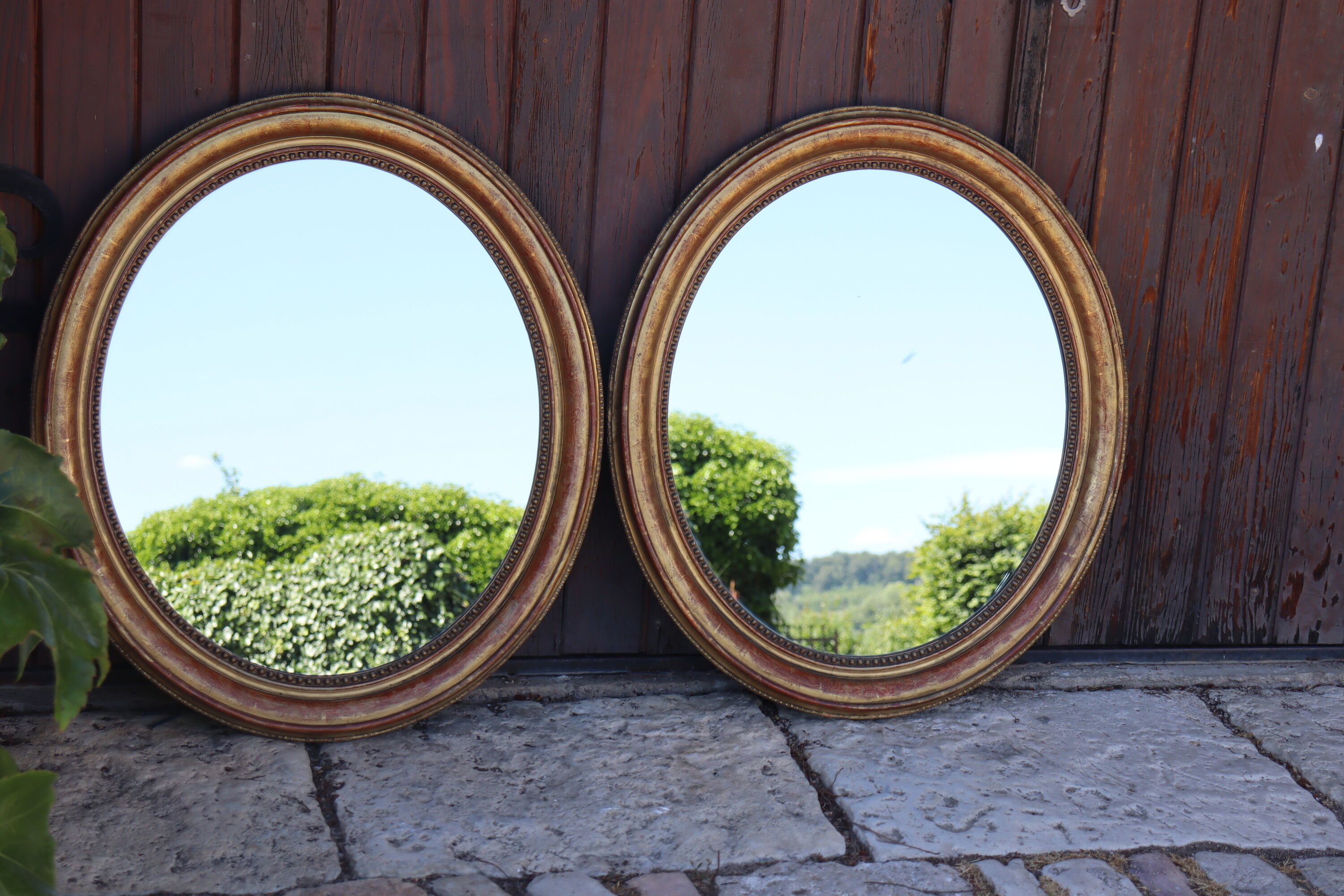 Pair of oval mirrors from the Louis Philippe period in gilded wood.