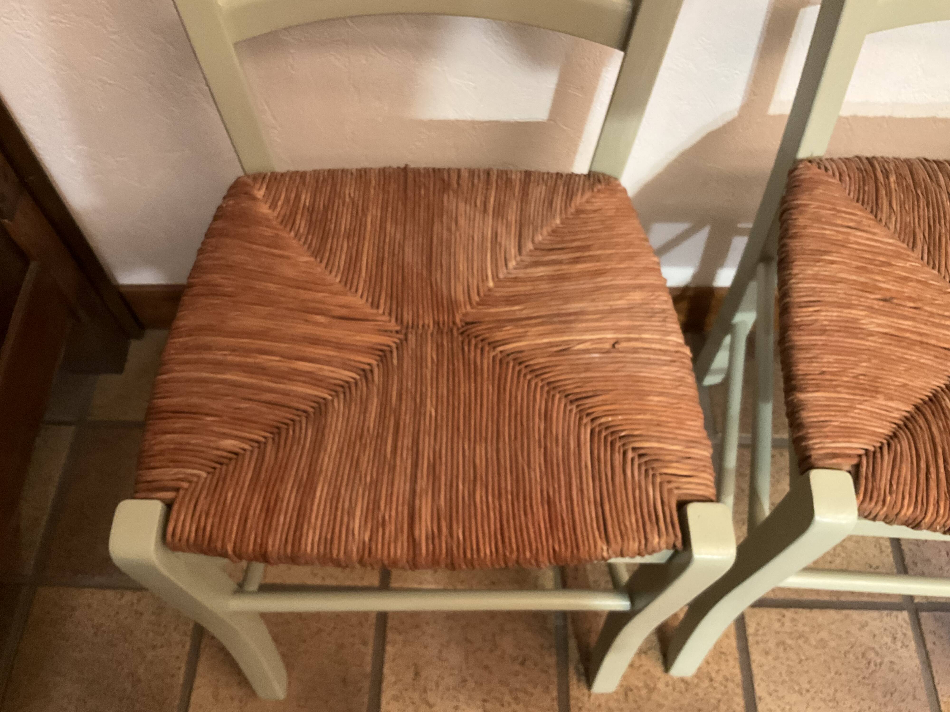 Pair of green straw chairs