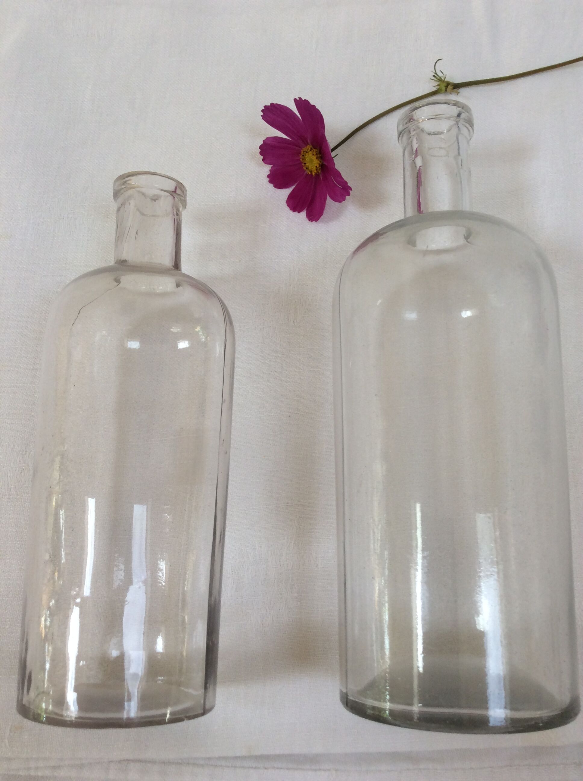 Pair of former pharmaceutical glass bottles