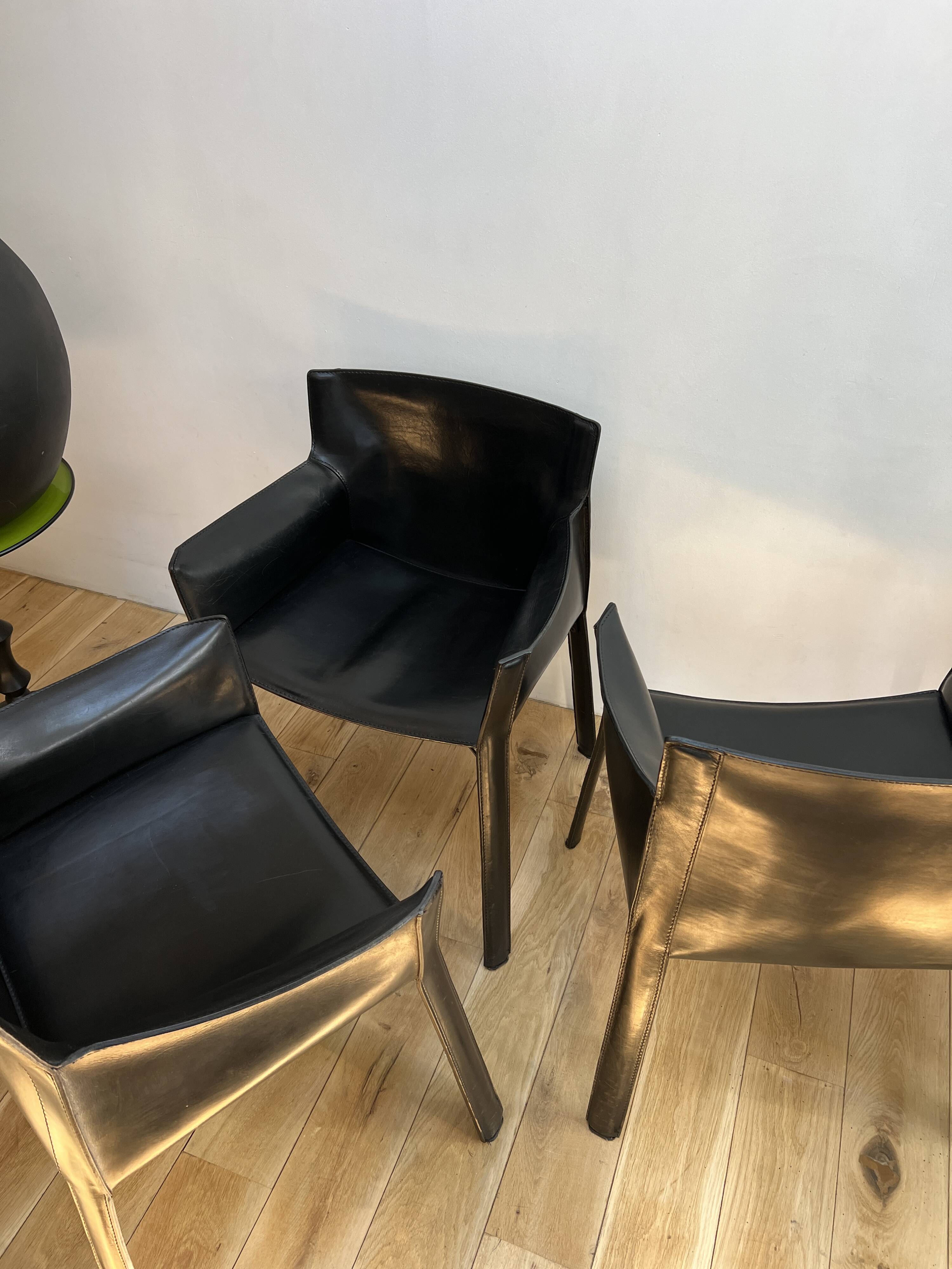 Set of 6 black leather armchairs from the 1970s