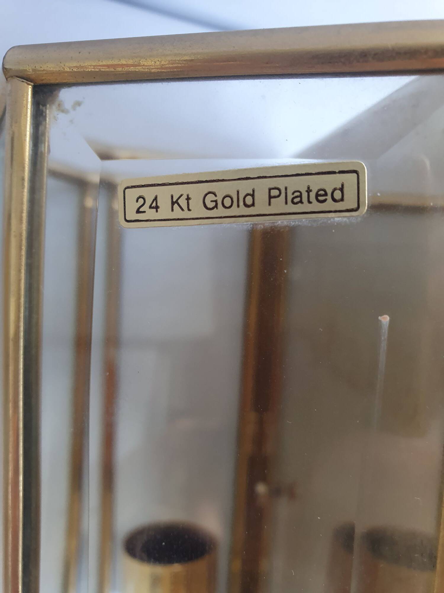 Pair of wall sconces in gold-plated brass with bevelled glass, Italian.