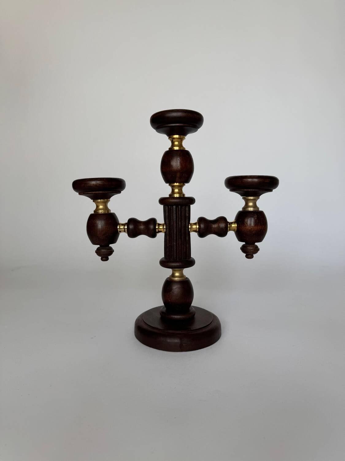 Vintage brutalist wooden candelabrum with gold hardware.
