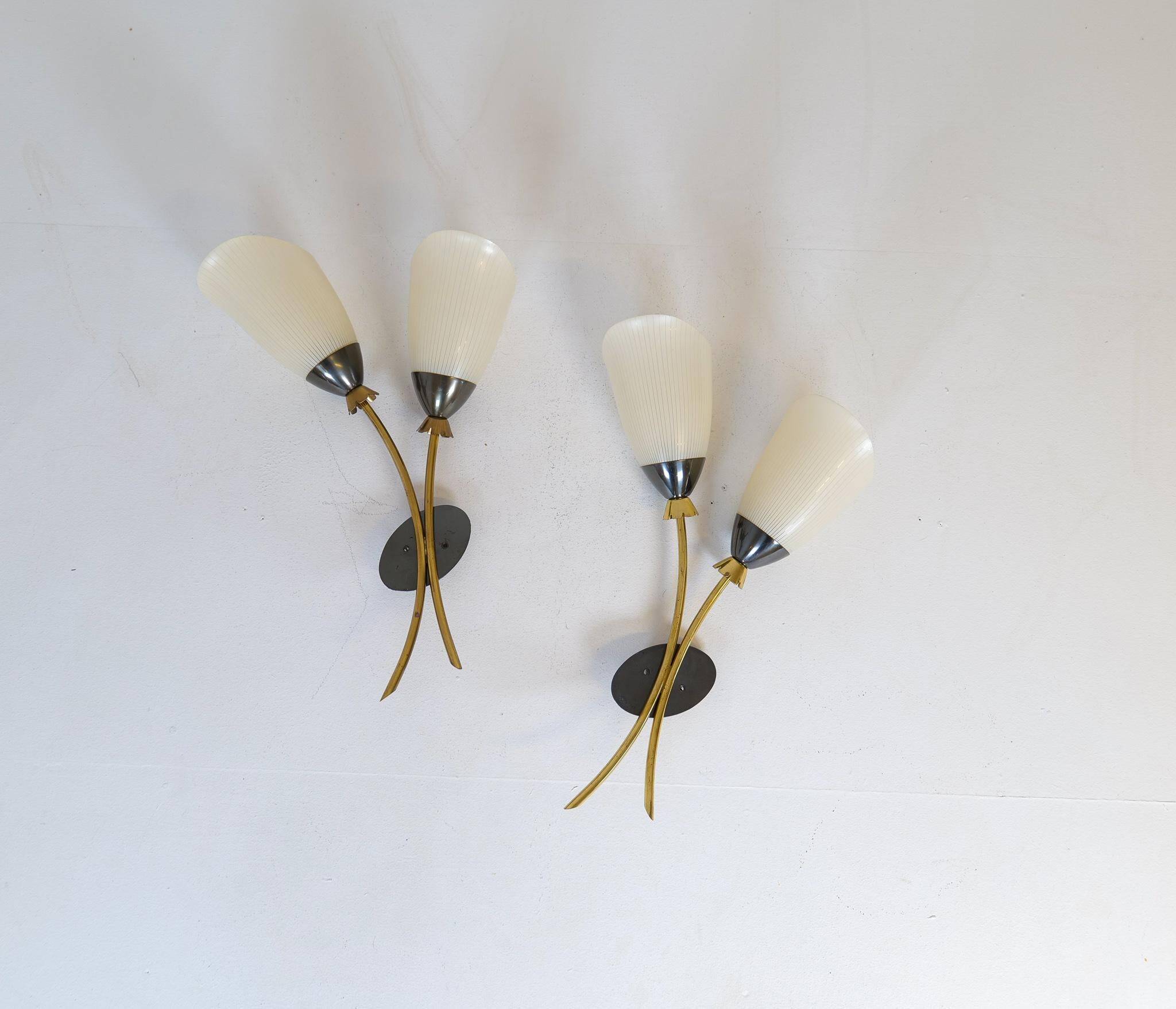Mid-century pair of wall lamps in brass and opaline attributed to Asea Sweden, 1950s.