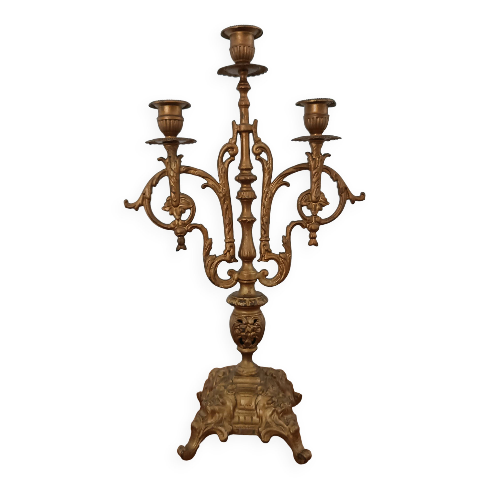 Bronze candlestick with lion head decoration