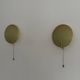 Pair of green plexiglass and gold metal wall lights by Erco, 1950s, Germany.