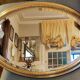 Old oval beveled golden mirror