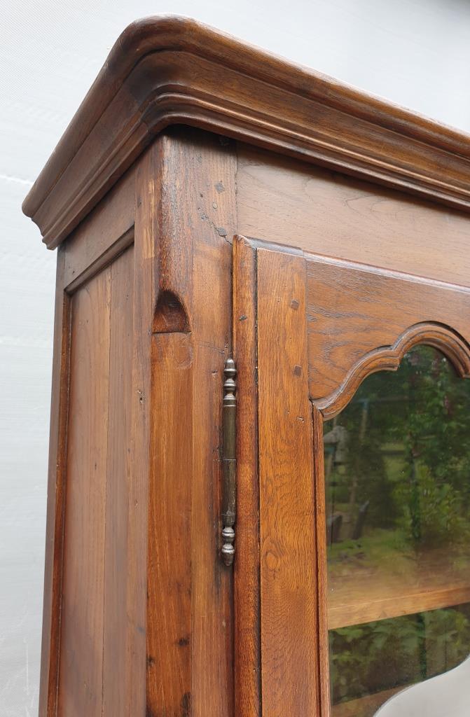 Walnut glazed bookcase with nineteenth century rose window