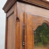Walnut glazed bookcase with nineteenth century rose window